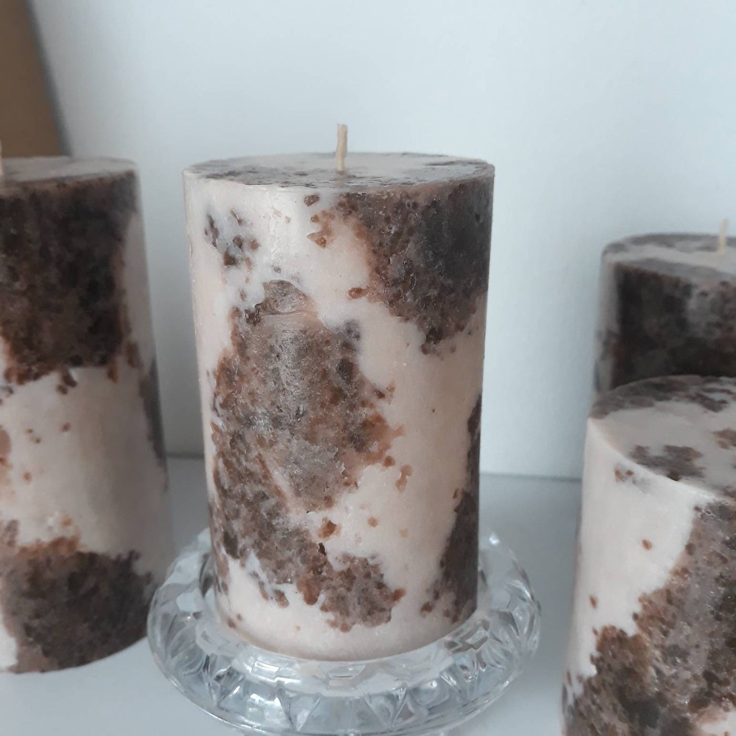 Brown and beige pillar candles. Decorative candles.