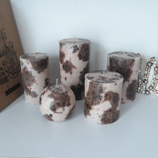 Brown and beige pillar candles. Decorative candles.