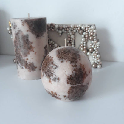 Brown and beige pillar candles. Decorative candles.