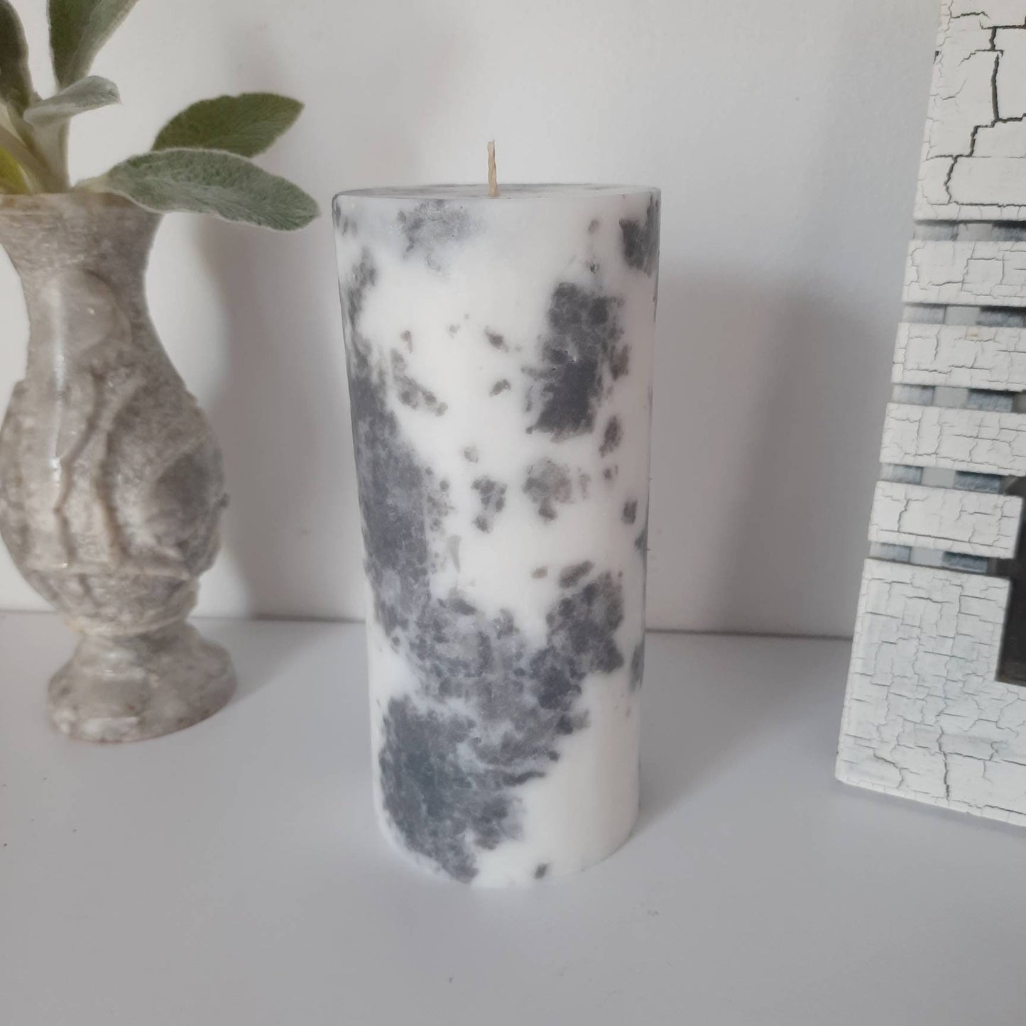 Grey and white decorative  candles. Pillar candles for home decor