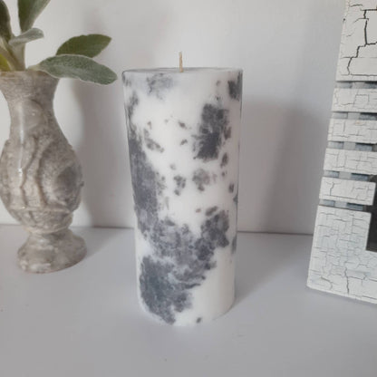 Grey and white decorative  candles. Pillar candles for home decor