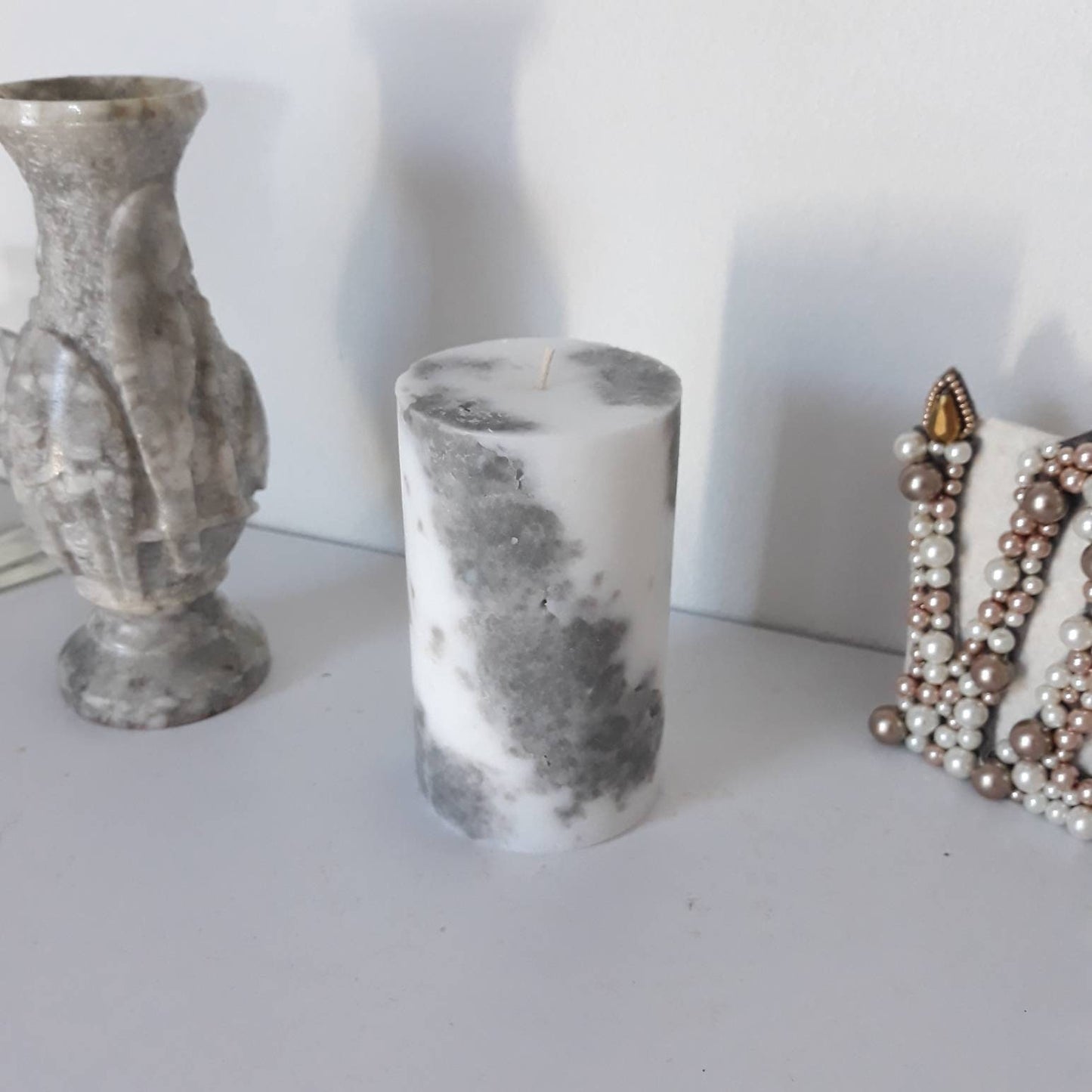 Grey and white decorative  candles. Pillar candles for home decor