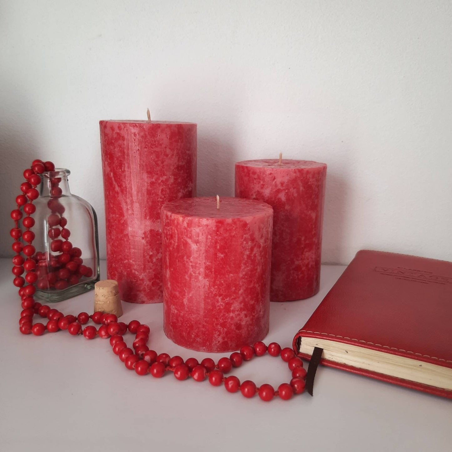 Red Pillar Candles. Decorative candles. Rose red candle. Unusual christmas candle