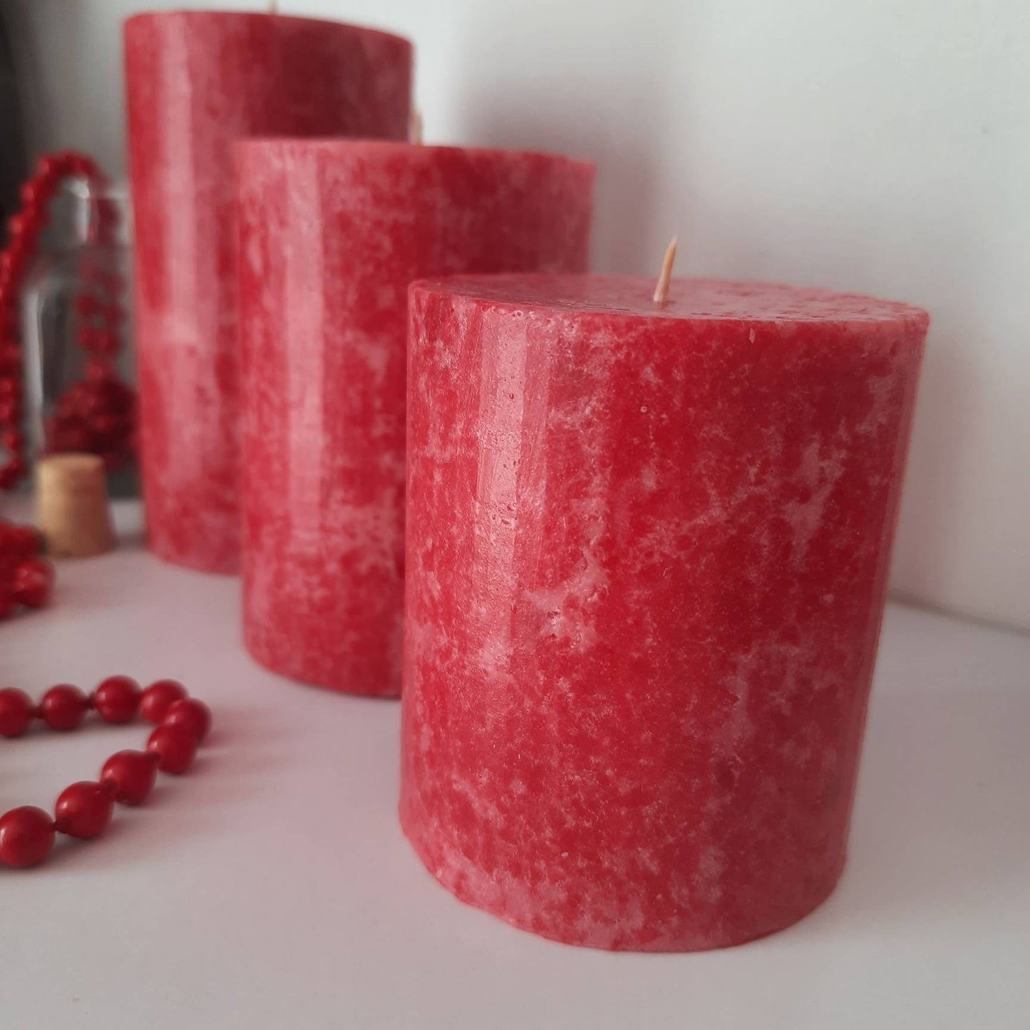 Red Pillar Candles. Decorative candles. Rose red candle. Unusual christmas candle